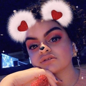 Mya in 2019 with poofy hEARts & pug nose